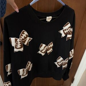 Peach Love California Black Pullover with Brown Football Bow Details